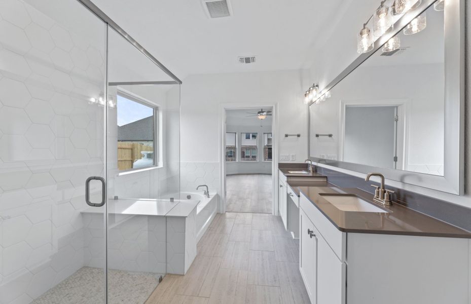 Owner's Bathroom with Walk-In Shower and Double Vanity Sinks