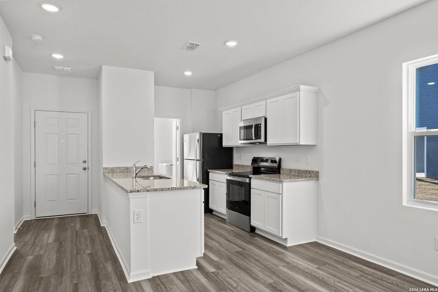 Furnished interior view inside a new home in Sutton Farms, San Antonio (Image 23).