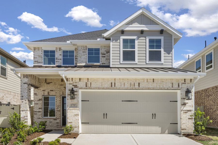 Front exterior of a new home in The Woodlands Hills, Willis, TX, highlighting curb appeal (Image 22).