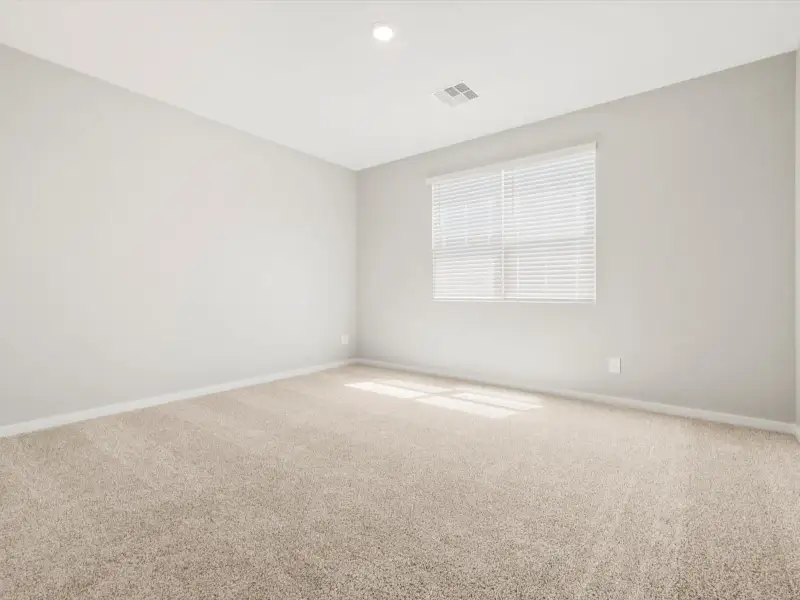Spacious, unfurnished interior of a new home in Blossom Rock Reserve Series, Apache Junction (Image 11).
