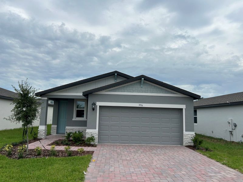 Front exterior of a new home in Villamar - Classic Series, Winter Haven, FL, highlighting curb appeal (Image 1). Front exterior of a new home in Villamar - Classic Series, Winter Haven, FL, highlighting curb appeal (Image 1).