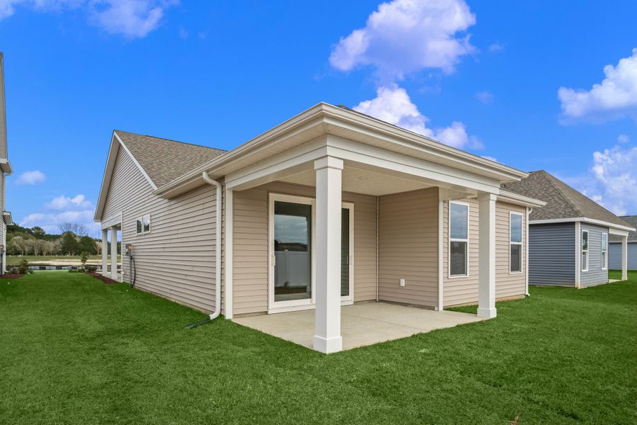 Exterior details and patio area of a home in Coastal Club of the Carolinas, Calabash (Image 3).
