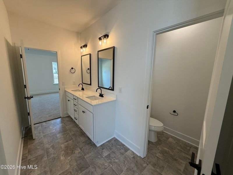 Furnished interior view inside a new home in Wood Creek Landing, Leland (Image 14).