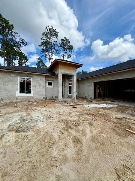 Front exterior of a new home in , Palm Coast, FL, highlighting curb appeal (Image 2).