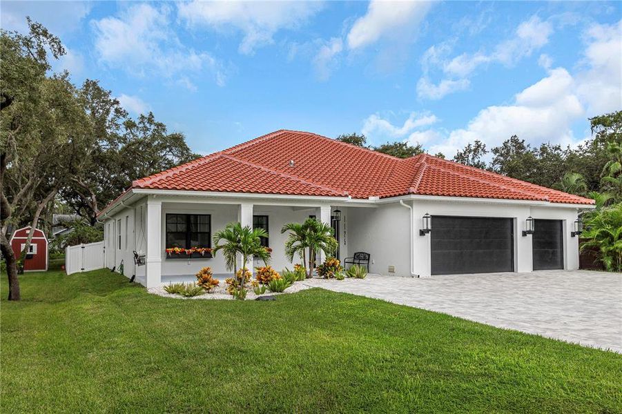 Front exterior of a new home in , Tarpon Springs, FL, highlighting curb appeal (Image 20).