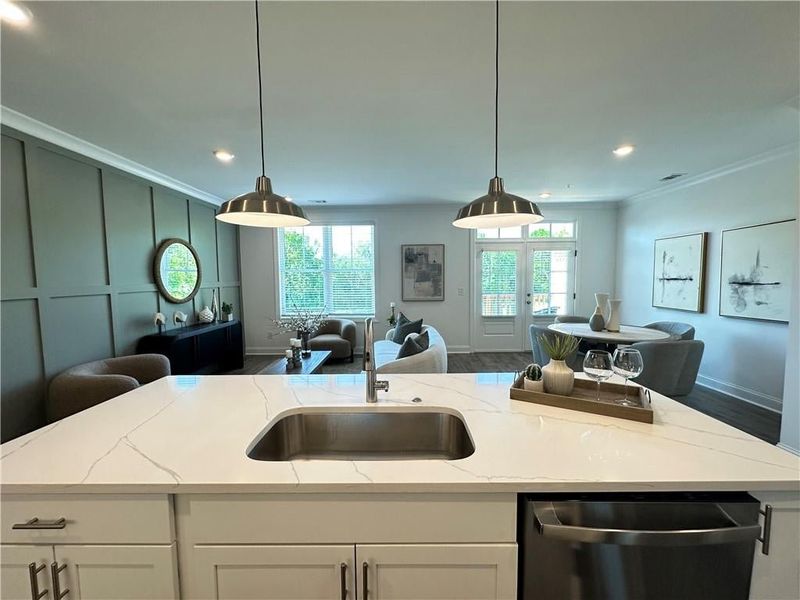 Views of kitchen overlook woods *photos are from the Magnolia model at different home site*