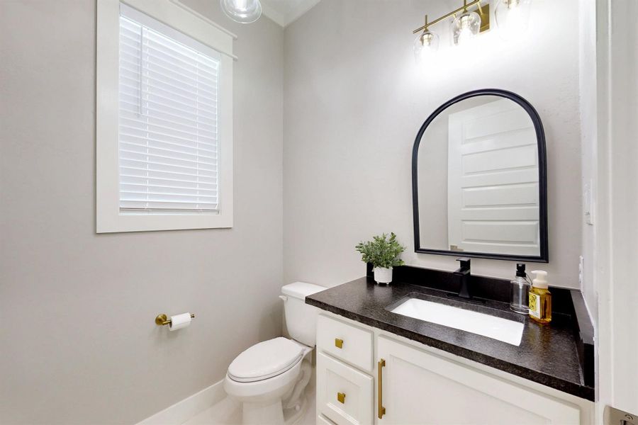 This is the half bath close to the back door entrance.