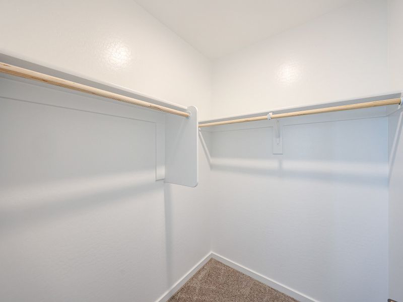 A white wall with a white railing. A white wall with a white railing.