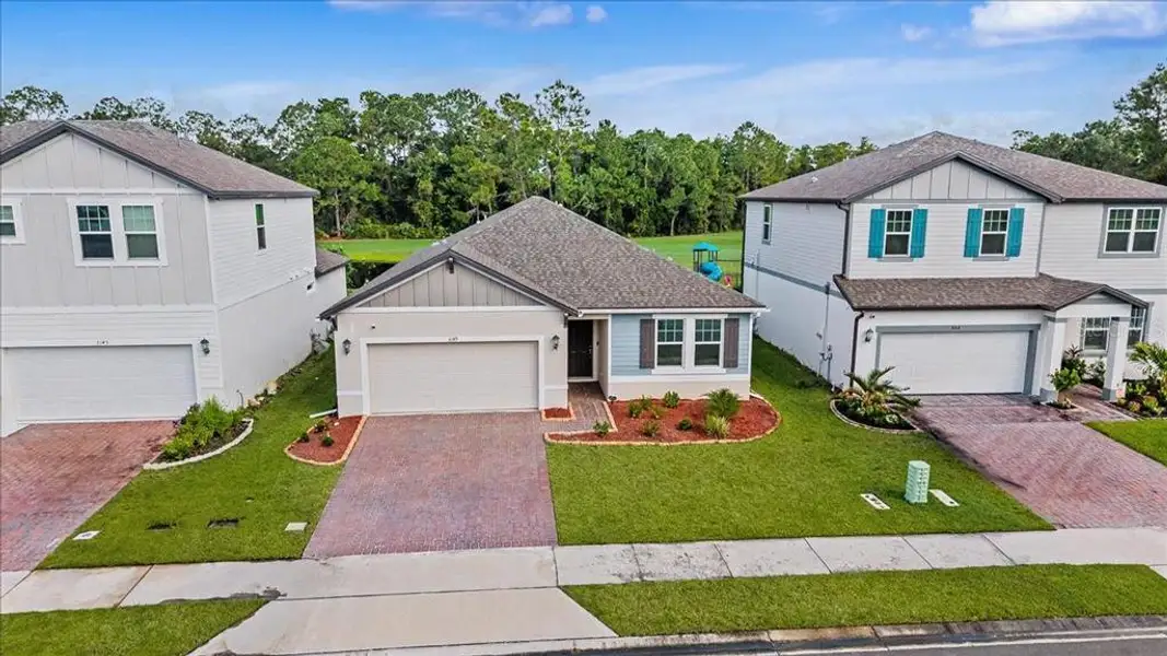 Front exterior of a new home in , Daytona Beach, FL, highlighting curb appeal (Image 1). Front exterior of a new home in , Daytona Beach, FL, highlighting curb appeal (Image 1).
