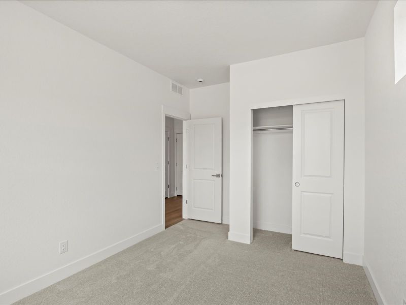 Representative unfurnished interior of a home built from the Nolan by Lokal Homes in The Commons at Victory Ridge, Colorado Springs (Image 9).
