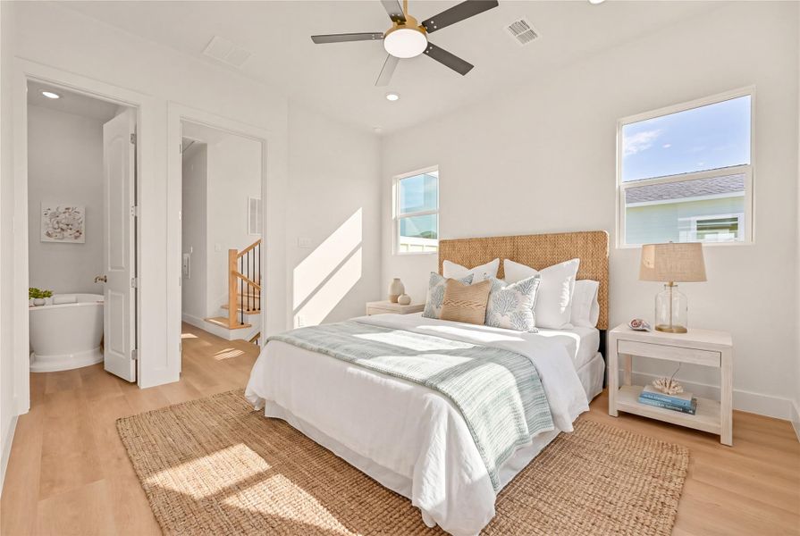 Primary Bedroom has ceiling fan and additional space for a seating area. Primary Bedroom has ceiling fan and additional space for a seating area.