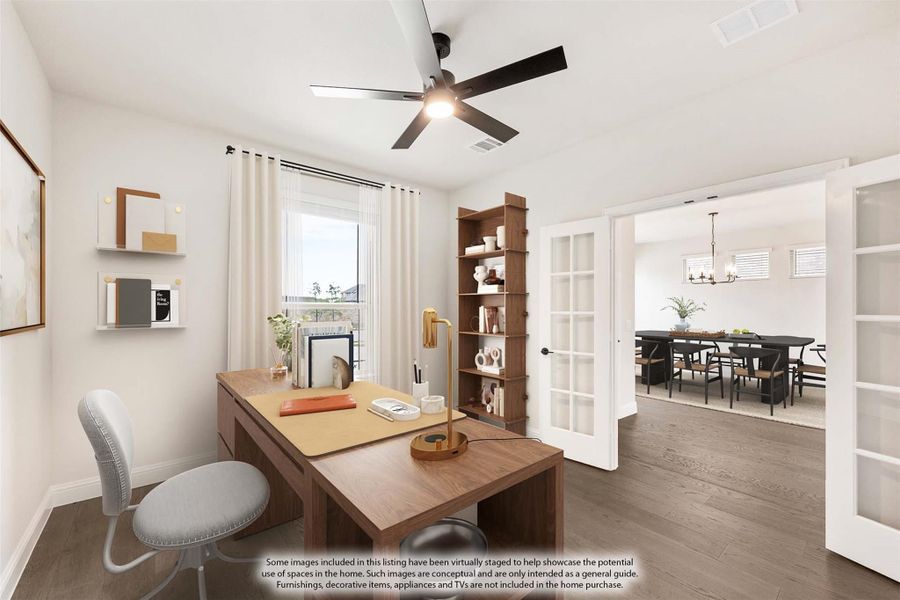 Home office with wood desk, ceiling fan, and French doors opening to dining room with hardwood floors