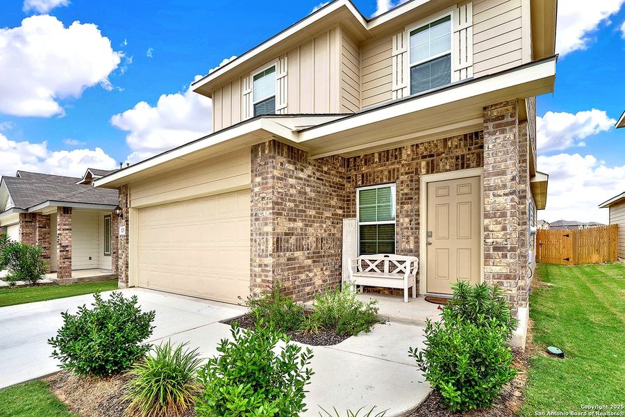 Front exterior of a new home in The Links at River Bend, Floresville, TX, highlighting curb appeal (Image 19).