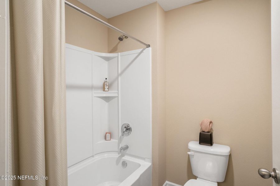 Furnished interior view inside a new home in Sawmill Branch, Palm Coast (Image 28).