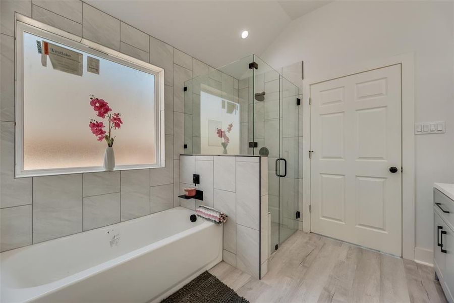 Primary Bedroom Tub and shower.