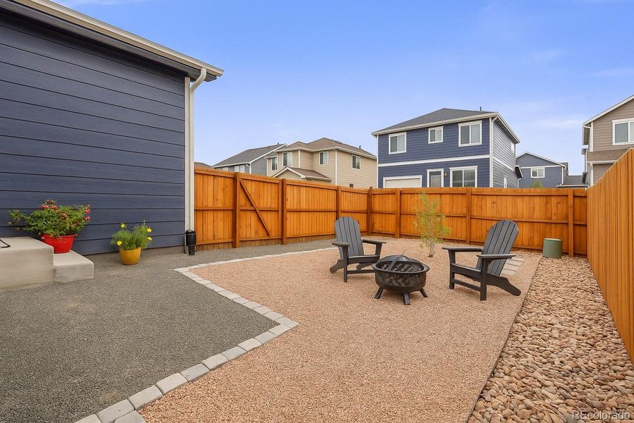 Fully fenced back yard with gate to driveway/alley. Potential to add grass or artificial turf.