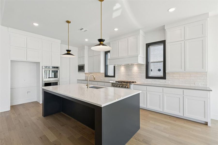 Beautiful cabinetry, gorgeous countertops and contemporary stainless appliances create a dream kitchen any chef would be proud to call their own!