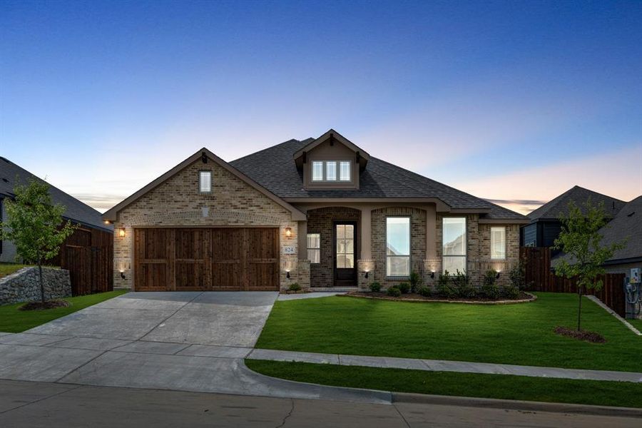 Front exterior of a new home in Homestead at Daniel Farms, DeSoto, TX, highlighting curb appeal (Image 24).