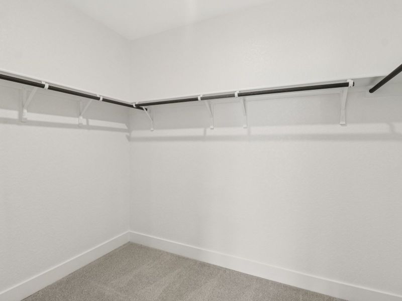 Primary suite walk-in closet in the Matador floorplan at a Meritage Homes community. Primary suite walk-in closet in the Matador floorplan at a Meritage Homes community.