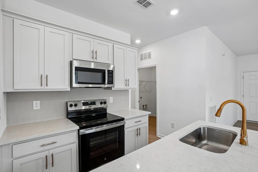 Kitchen featuring the AW Collection® Serene - Clean lines and earthy textures define the space.
