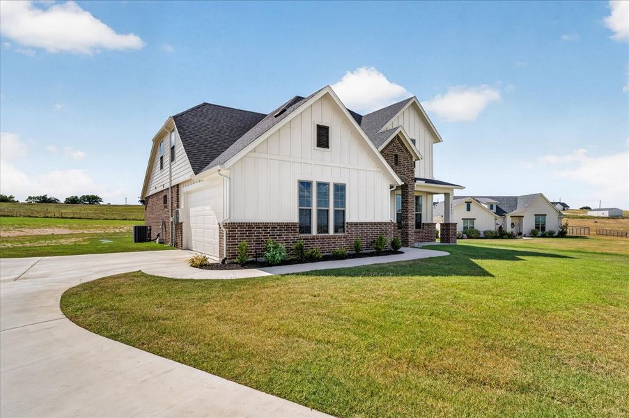 Front exterior of a new home in The Ranches at Valley View, Springtown, TX, highlighting curb appeal (Image 30).