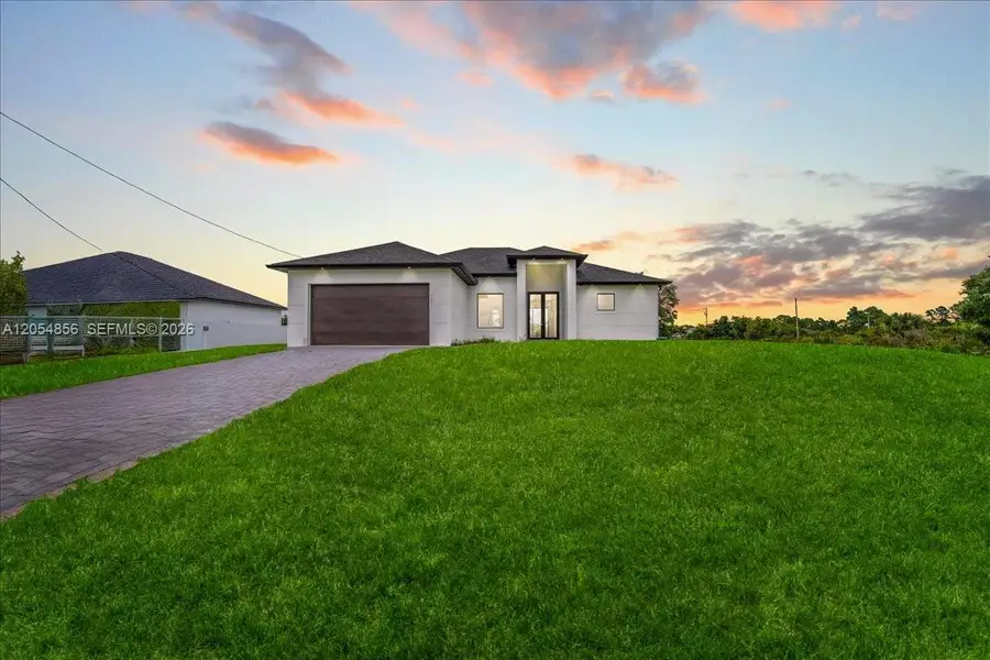 Front exterior of a new home in , Lehigh Acres, FL, highlighting curb appeal (Image 18). Front exterior of a new home in , Lehigh Acres, FL, highlighting curb appeal (Image 18).