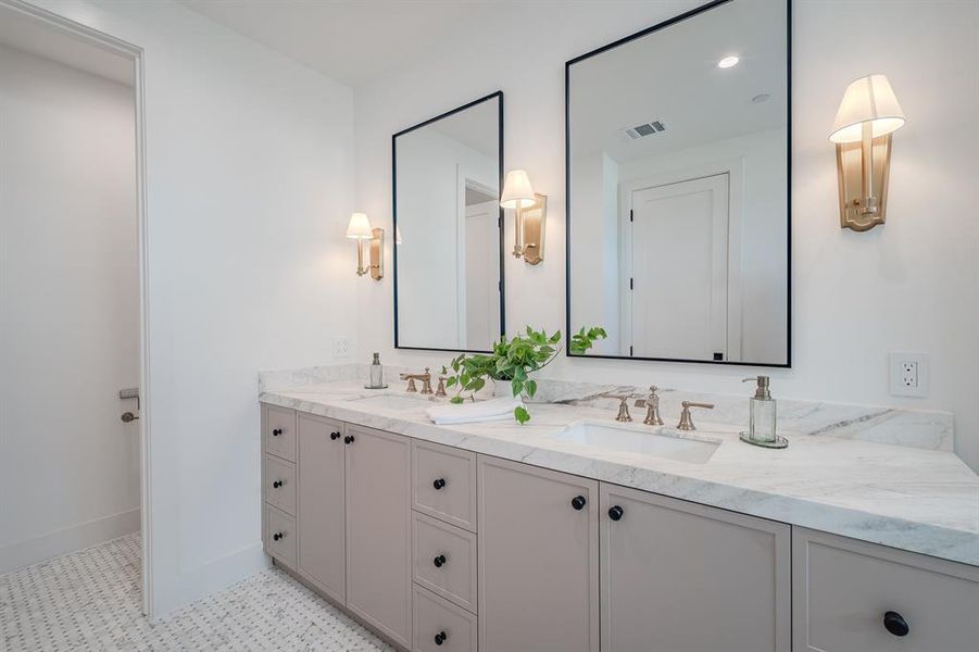 Full bathroom featuring double vanity and recessed lighting