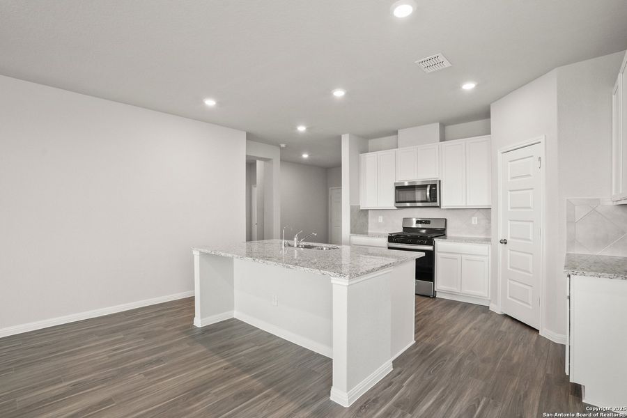 Furnished interior view inside a new home in Hunters Ranch, San Antonio (Image 7).