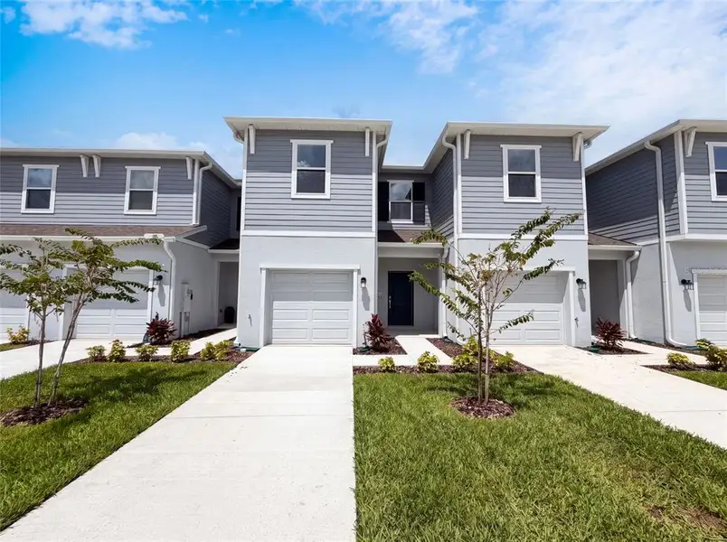 Front exterior of a new home in , Davenport, FL, highlighting curb appeal (Image 2). Front exterior of a new home in , Davenport, FL, highlighting curb appeal (Image 2).
