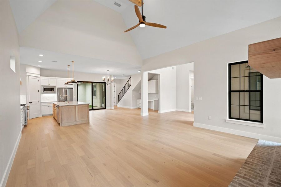 An open floorplan seamlessly connects the kitchen and living areas, offering effortless movement and a sense of airiness. An open floorplan seamlessly connects the kitchen and living areas, offering effortless movement and a sense of airiness.
