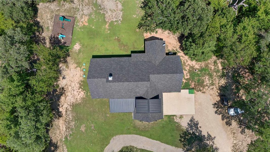 Hallway featuring carpet floors, recessed lighting, and a textured wall Hallway featuring carpet floors, recessed lighting, and a textured wall