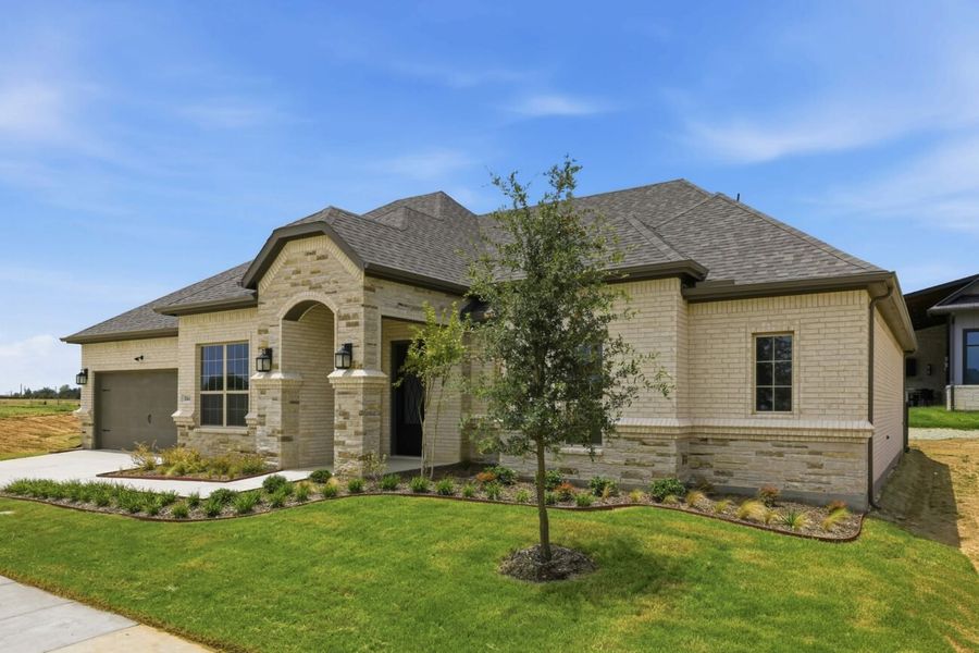 Front exterior of a new home in Ladera Little Elm, Little Elm, TX, highlighting curb appeal (Image 2). Front exterior of a new home in Ladera Little Elm, Little Elm, TX, highlighting curb appeal (Image 2).