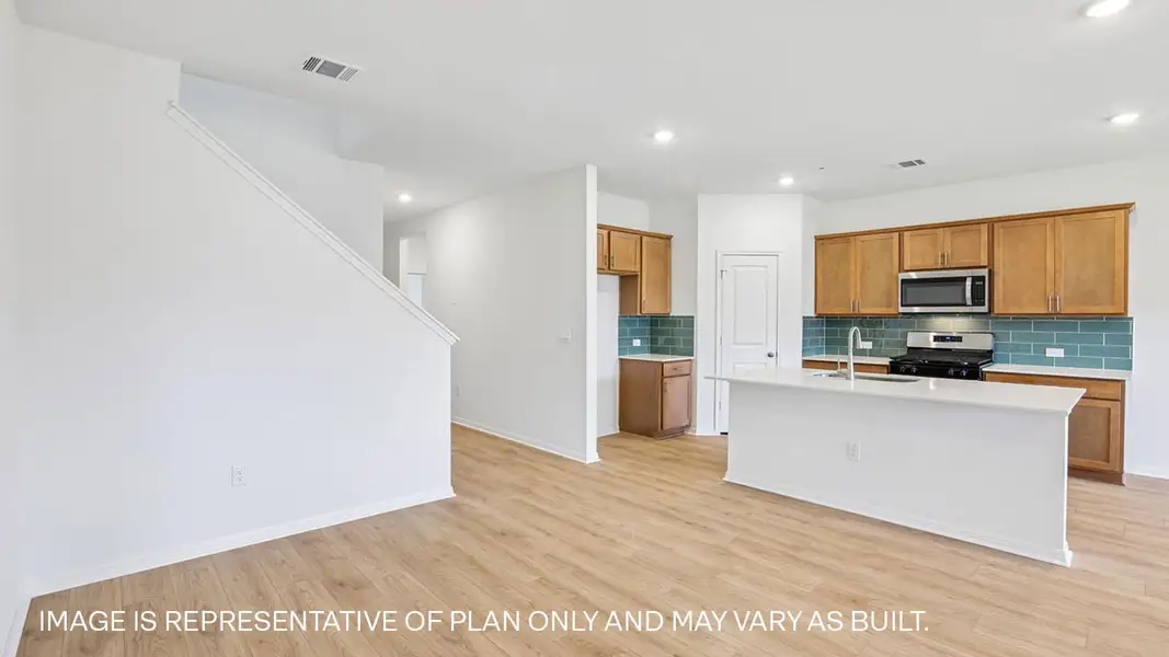 Furnished interior view inside a new home in Bar W Ranch, Leander (Image 3).