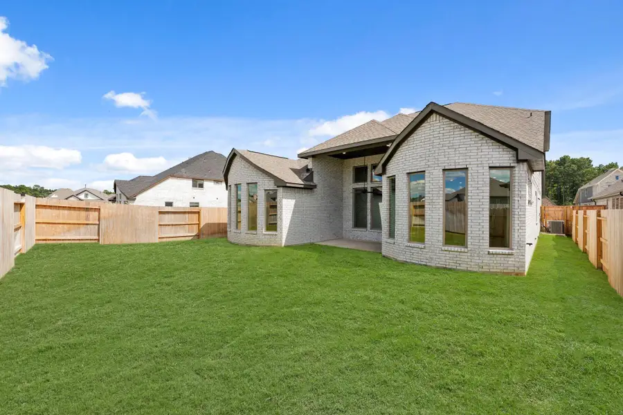Exterior details and patio area of a home in The Trails, New Caney (Image 3). Exterior details and patio area of a home in The Trails, New Caney (Image 3).