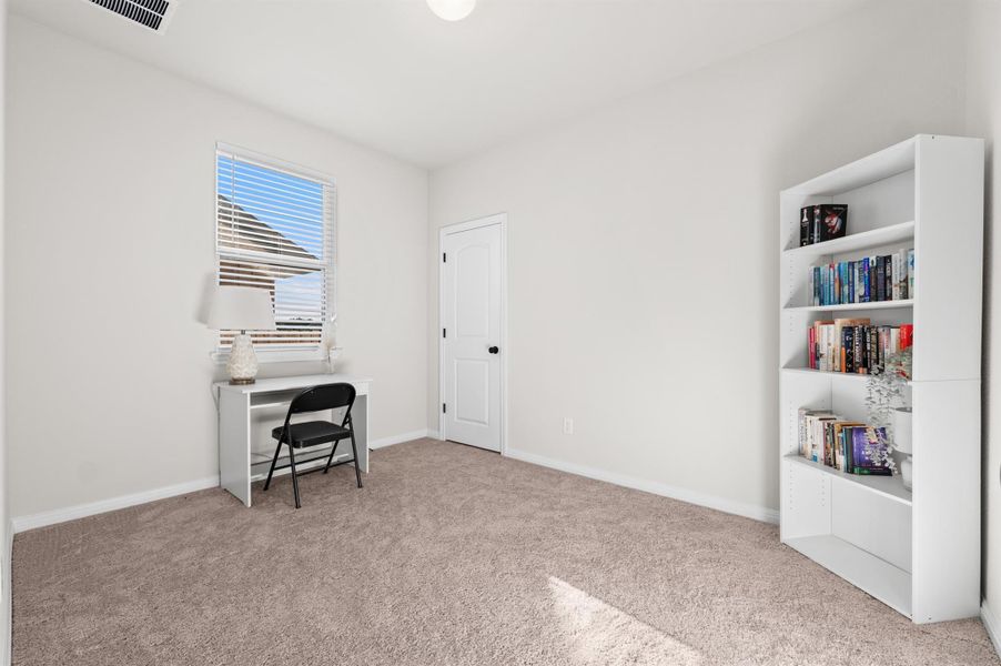Bedroom with light colored carpet and baseboards Bedroom with light colored carpet and baseboards