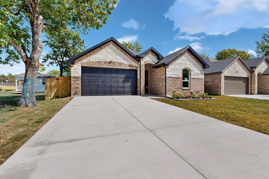 Front exterior of a new home in , Ennis, TX, highlighting curb appeal (Image 18).