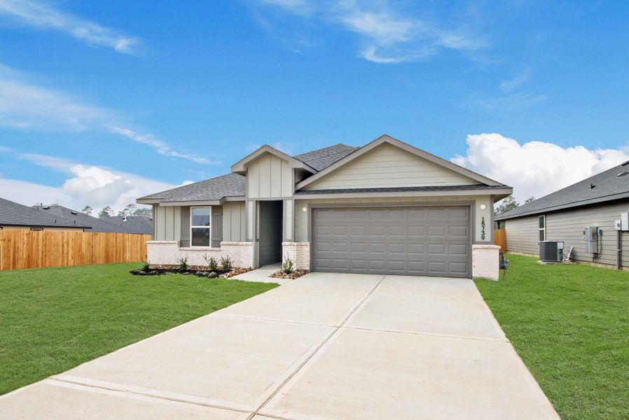 Front exterior of a new home in Chapel Lakes 50's, Montgomery, TX, highlighting curb appeal (Image 19).