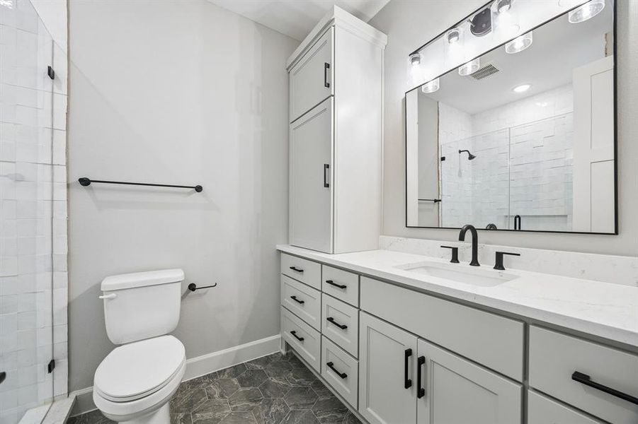 Full bath featuring vanity and a shower stall Full bath featuring vanity and a shower stall