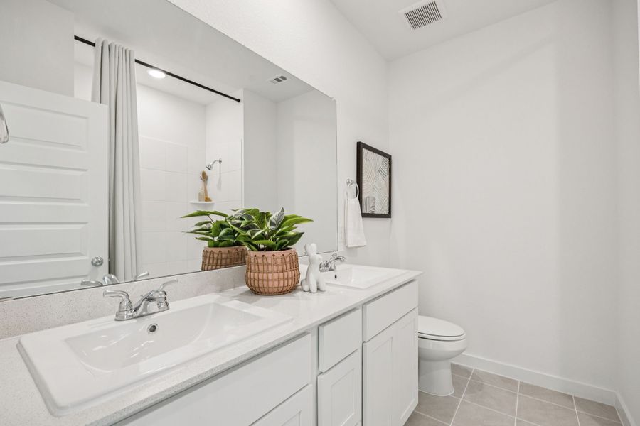 Bathroom in the Trinity home plan by Trophy Signature Homes – REPRESENTATIVE PHOTO Bathroom in the Trinity home plan by Trophy Signature Homes – REPRESENTATIVE PHOTO