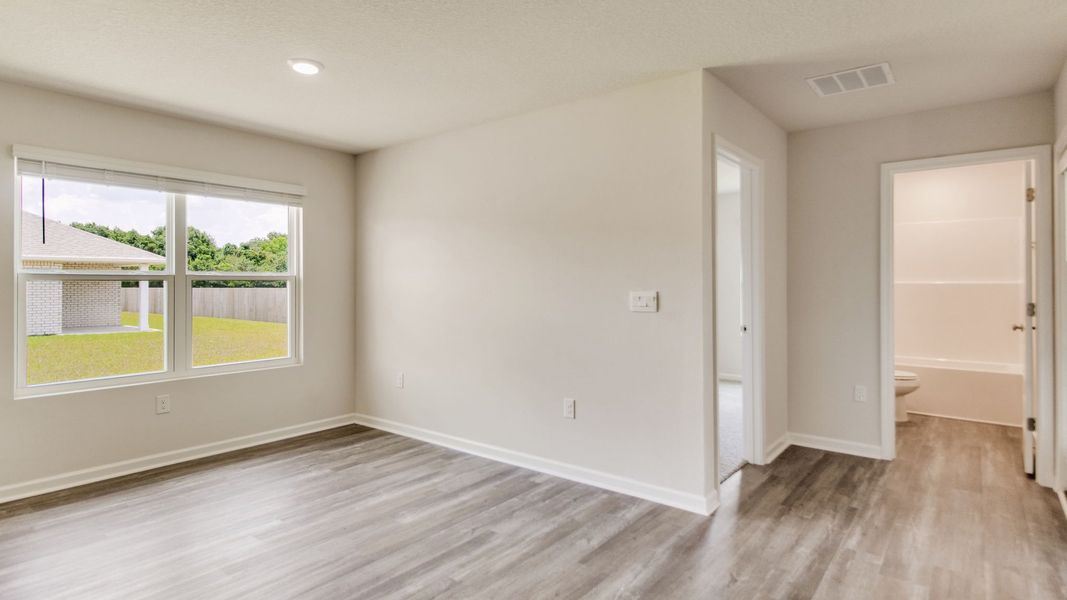 Spacious, unfurnished interior of a new home in The Enclave at Bar W Ranch, Baker (Image 13).