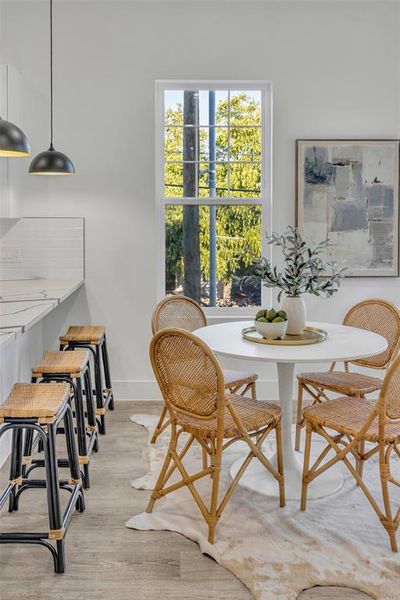 Dining space with light hardwood / wood-style floors