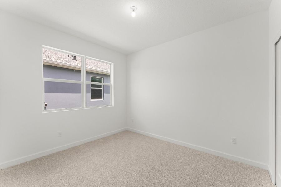 Spacious, unfurnished interior of a new home in Tradition - Cadence, Port St. Lucie (Image 14).