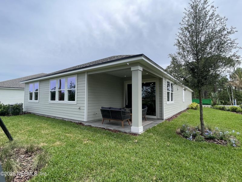 Exterior details and patio area of a home in The Magnolia Series at Reserve East, Flagler Beach (Image 2). Exterior details and patio area of a home in The Magnolia Series at Reserve East, Flagler Beach (Image 2).
