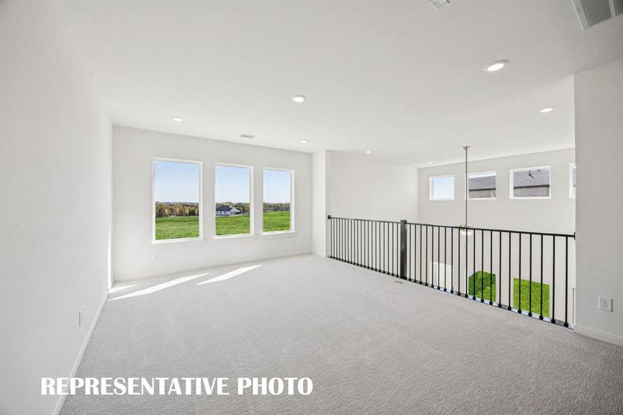 Light, bright and open, this lovely game room is the perfect place to host those big game day parties!  REPRESENTATIVE PHOTO