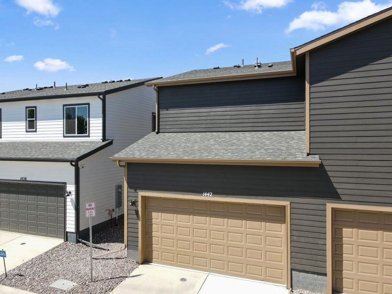 Front exterior of a new home in Spring Valley, Longmont, CO, highlighting curb appeal (Image 20).