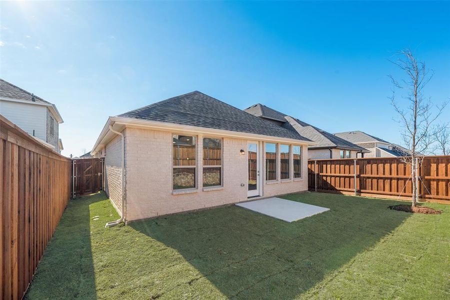 Exterior details and patio area of a home in Spiritas Ranch, Little Elm (Image 3).