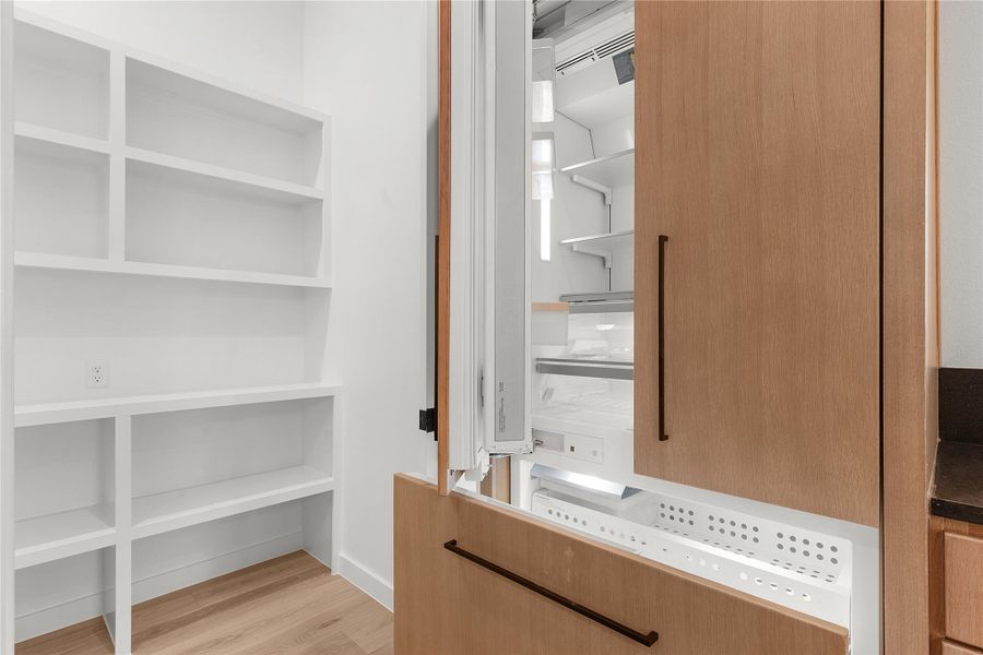 View of pantry and refrigerator View of pantry and refrigerator