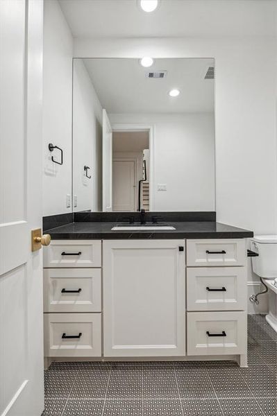 Conveniently located next to the game room, this half bath ensures your guests can refresh without intruding on your private bathrooms!