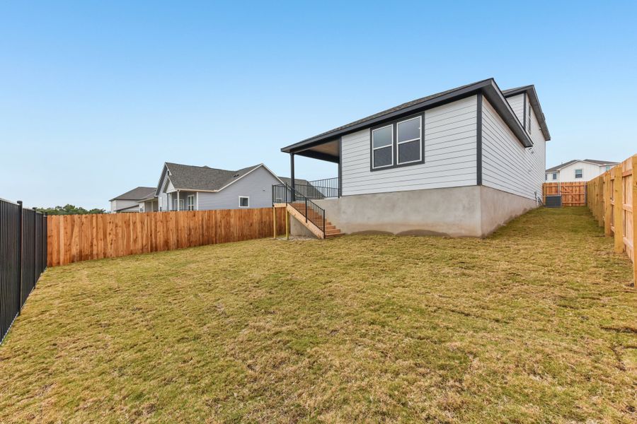 A house with a fence around it. A house with a fence around it.