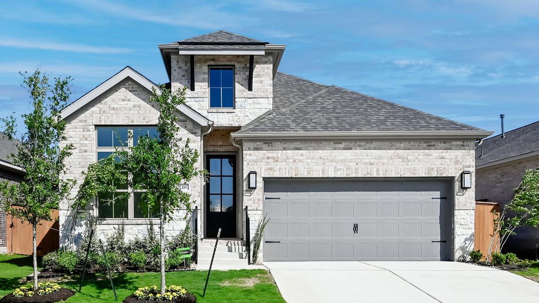 Front exterior of a new home in Crosswinds 50', Kyle, TX, highlighting curb appeal (Image 21). Front exterior of a new home in Crosswinds 50', Kyle, TX, highlighting curb appeal (Image 21).